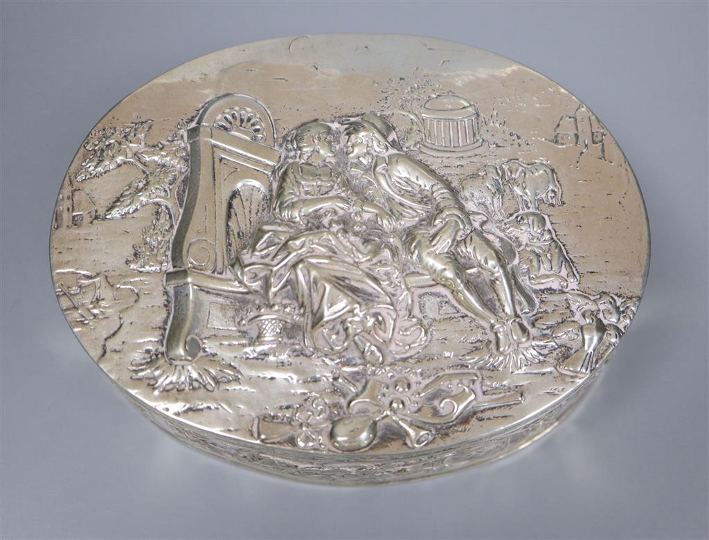 A late 19th/early 20th century German embossed 800 white metal oval box with hinged cover, 13.4cm,